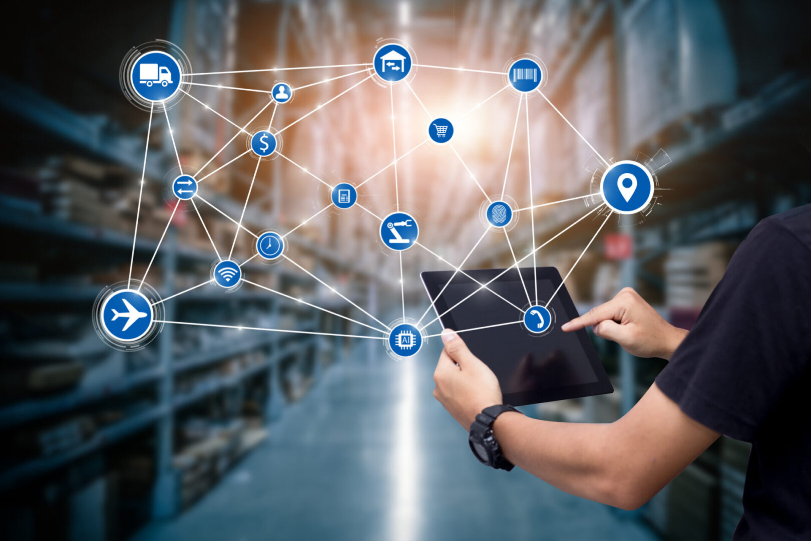 Person using tablet in connected warehouse.